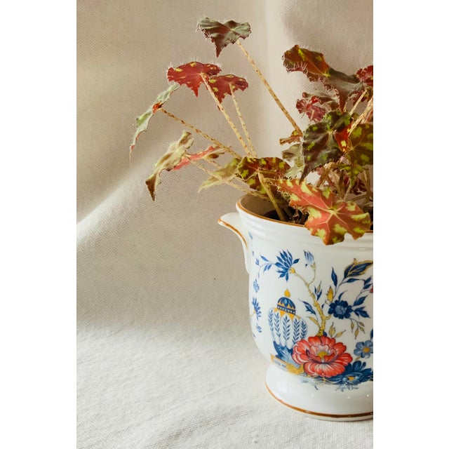 An exquisite English bone china cachepot in the elegant PENANG pattern — that most enduring and romantic of all...