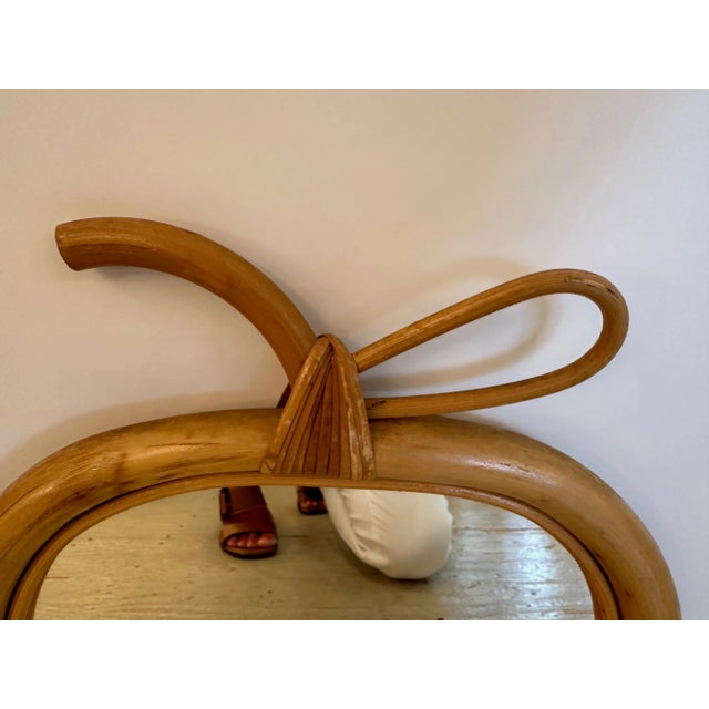 Pair of French mid century rattan and wicker apple form mirrors.