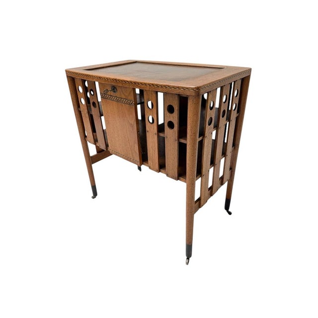 Magnificent and rare Vienna Secession cabinet with small door. Striking Austrian design from the 1900s. Solid oak base...