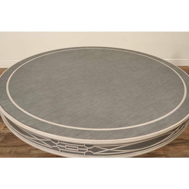 Blue and gray center table or dining table. 30" tall drum table with fret-carved apron in a blue and light gray color....