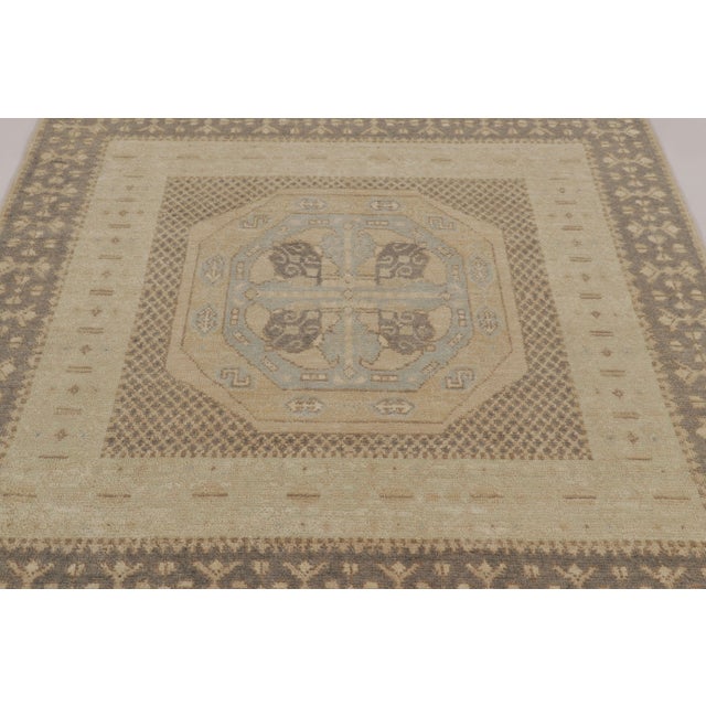 Inspired by the grand geometric traditions of Anatolian Turkish rugs, this hand-knotted 6x6 square wool rug is a masterful...
