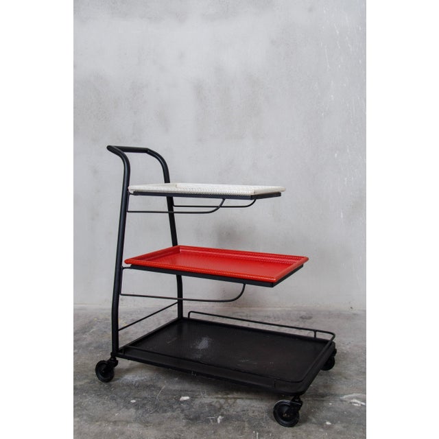 This Demon tea trolley was designed and produced by French designer Mathieu Matégot in 1952 in France. It features...