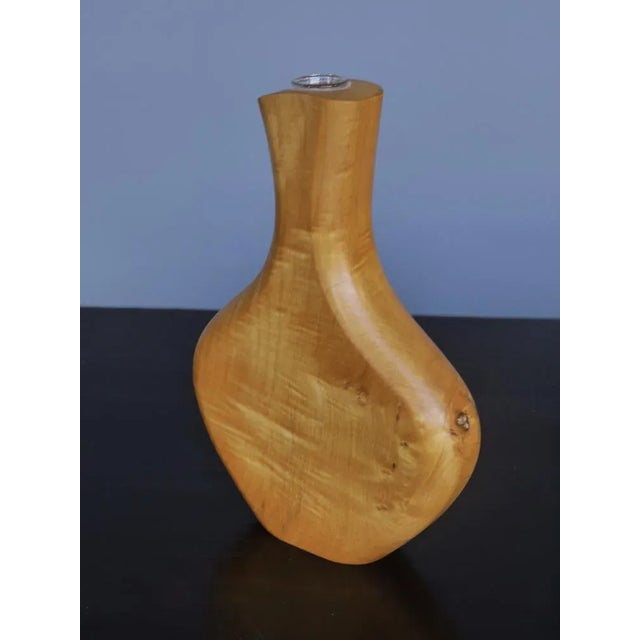 This vase is made to only hold a single stem plant - One that will complement the free-form of the sculptural vase. It is...