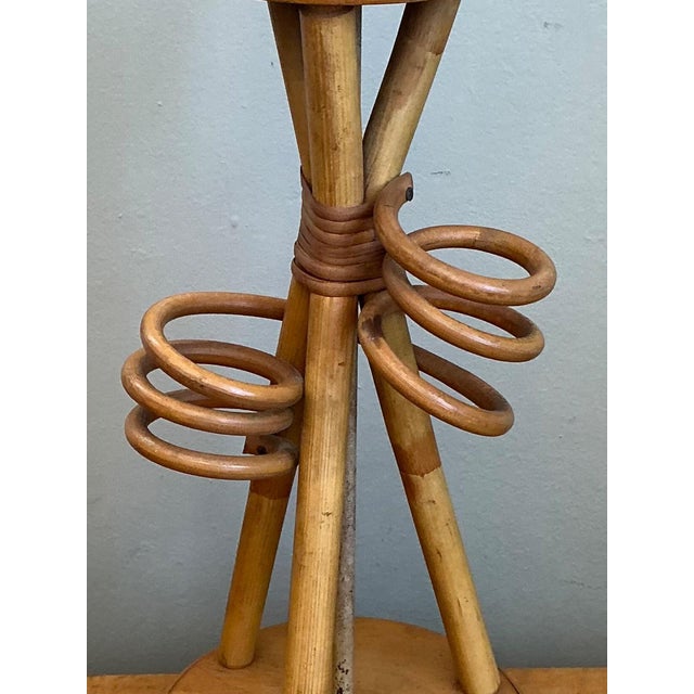 Celebrate the timeless appeal of mid-century modern design with this vintage rattan and wood table lamp, a beautifully...