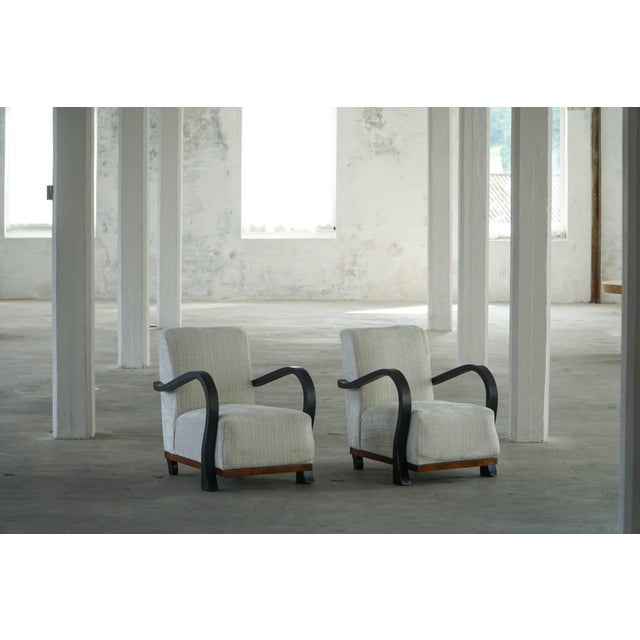 An exquisite pair of Swedish lounge chairs from the Art Deco period, likely dating to the 1930s–1940s, characterized by...