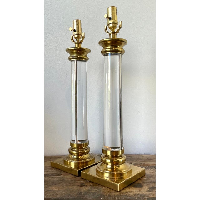 Elevate your interior with this sophisticated pair of vintage Hollywood Regency column lamps. A masterful blend of...