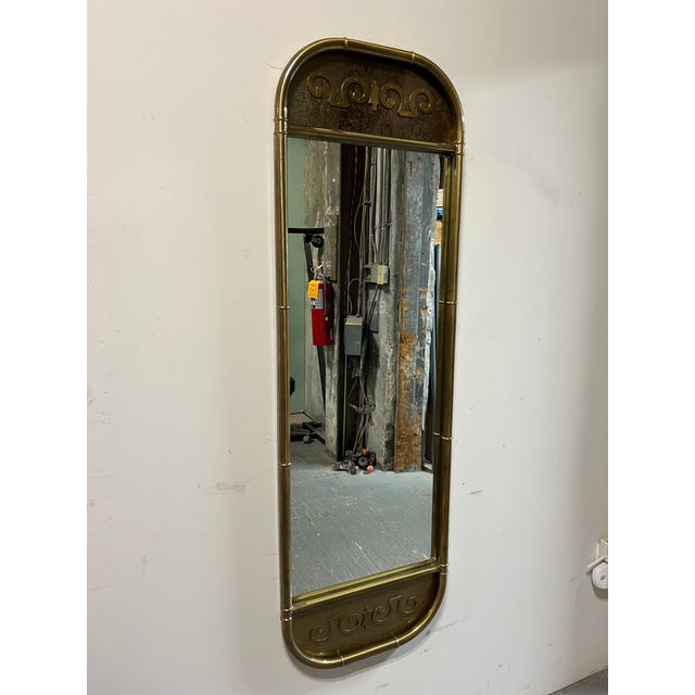This mirror is absolutely fantastic. It features a sort of bamboo look outer border. There are inset acid etched brass...