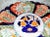 Bold colored classic late 1800-1900s Japanese imari porcelain charger bowl with scalloped edge, hand decorated in...
