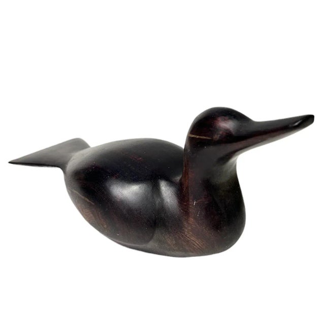 Add some charm to your coffee table or shelf with this vintage ironwood brass duck. A fine sculptural quality piece with a...