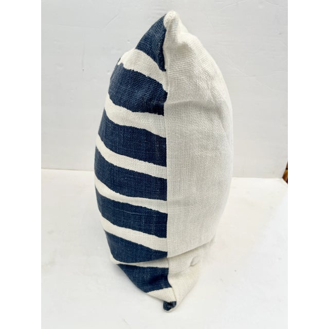 Fun square blue and white striped toss pillow for decor. Add it to your sea tropical interiors and furniture.
