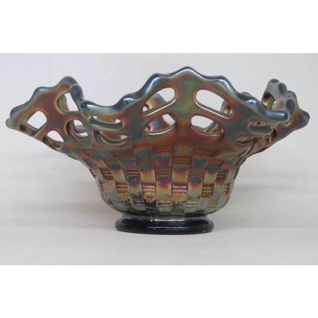 This gorgeous Bonbon/Candy Dish is made out of carnival glass. We believe it was made by Fenton due to its design, however...