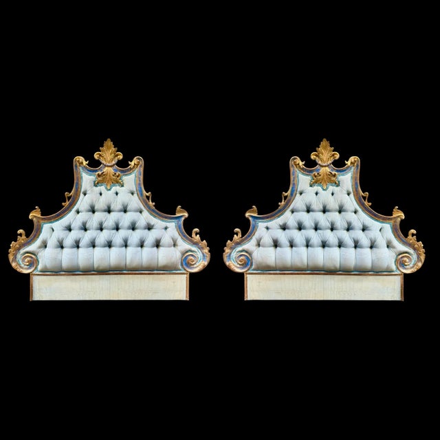 This elegant pair of antique Italian twin-sized headboards features ornate, gilded wooden frames and tufted upholstery,...