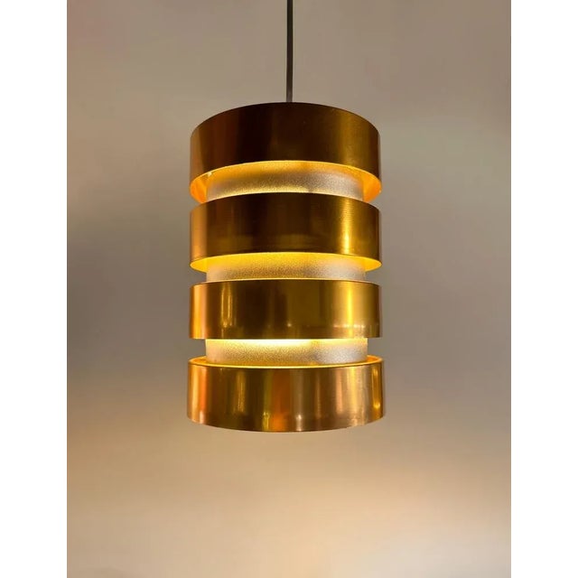 A stunning pair of mid century copper pendants by carl thore for granhaga sweden designed in 1966. Crafted with beautiful...