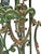 The French early Art Nouveau cast iron magazine rack is painted green with red, blue, and gilded details. Perfectly...