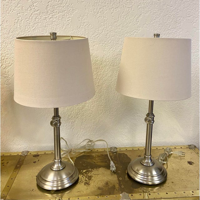 Traditionally styled Chelsea table lamps by pottery barn featuring a weighted foundation and telescoping design. Antique...