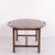 Large Butler coffee table crafted in polished mahogany with brass fittings. Dating from around the 1940s, the table...