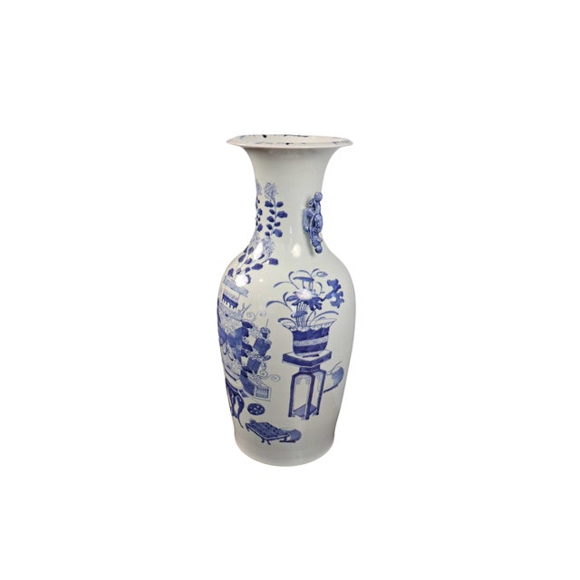 A striking antique Chinese blue and white porcelain floor vase featuring intricate hand-painted cobalt decoration on a...