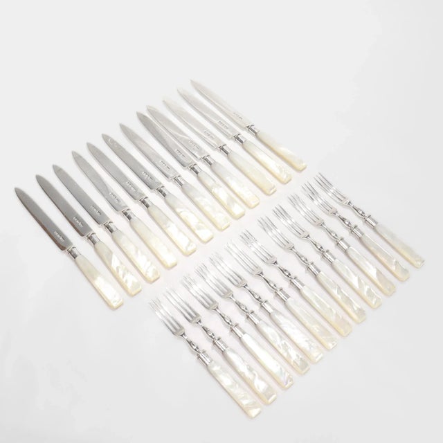 A fine antique Edwardian boxed fruit or dessert set. By Wilson & Gill of Sheffield, England. Comprising 12 3-tine forks...