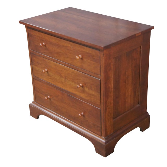Durham Furniture bedside table, end table or chest. Made from cherry with three dovetailed drawers, paneled sides and...