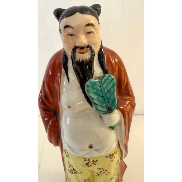 This is a vintage Chinese Taoist porcelain sculpture, representing one of the Eight Immortals or the God of Longevity....