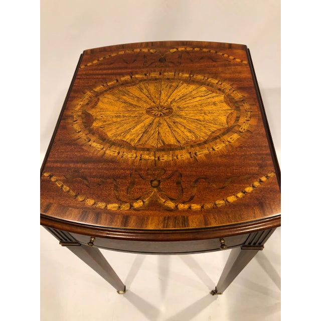Magnificent pair of inlaid mixed wood drop leaf end tables that measure 15.25 w and are rectangular with the leaves down;...
