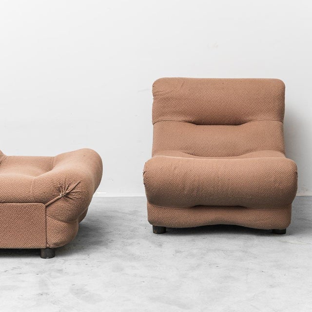 Pair of Rezia armchairs designed by Emilio Guarnacci for 1p, made in the 1970s. Brown fabric upholstery. Wooden legs. Good...