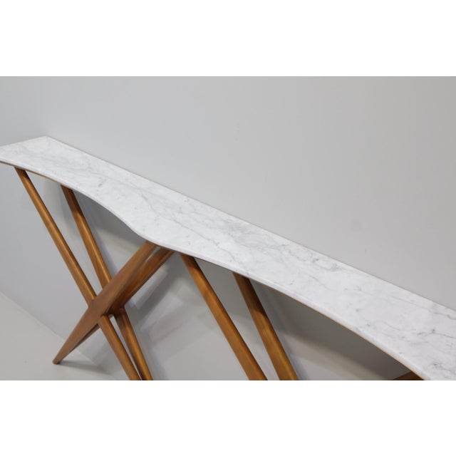 Large and elegant console table with a curved carrara marble top designed by bbpr designed for the belsana office in...
