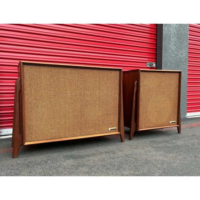 This stunning rare refurbished mid-century Packard Bell stereo console is a true atomic-era showpiece. The walnut cabinet...