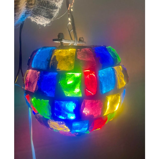 This is a fantastic brutalist style hanging globe made of large chunks of glass fragments in a multitude of colors...