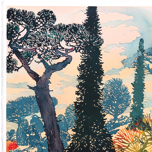 Max Naylor’s “Blue Drift” moves through a sunlit landscape filled with twisting trees, coral-like branches, and layered...