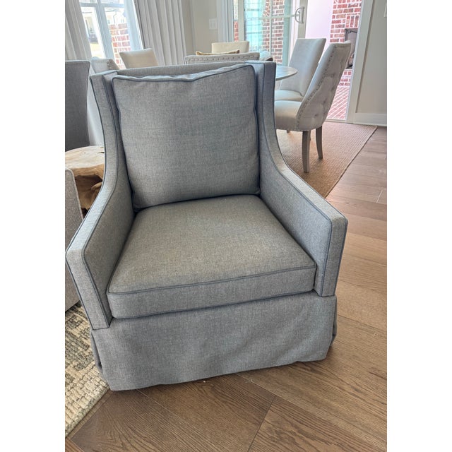 Lee Industry pair of swivel glider linen chairs. 2025, piped in darker grey trim. Color is medium grey linen with blue...
