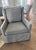 Lee Industry pair of swivel glider linen chairs. 2025, piped in darker grey trim. Color is medium grey linen with blue...