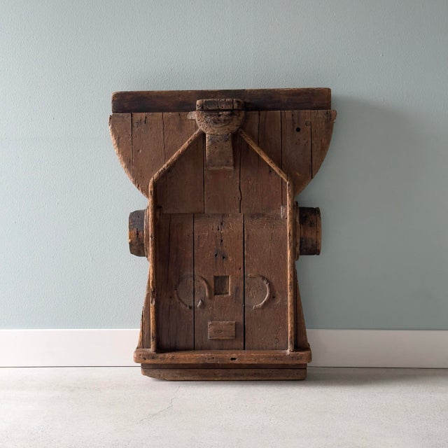This unusual wood object was likely used as a mold in a factory. It was salvaged and repurposed to serve as a unique...