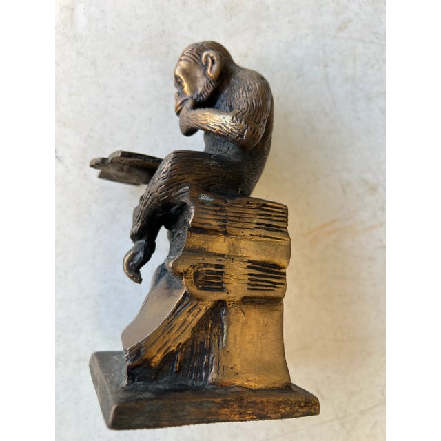 Mid Century Heavy solid bronze monkey/ Chimpanzee reading a book. Measuring about 7” tall. Use as a bookend or display...