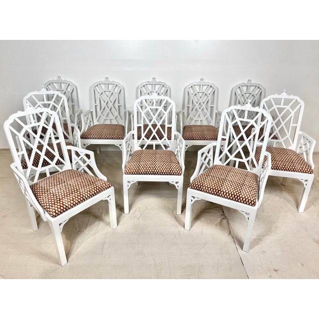 Vintage set of 10 pagoda dining chairs. Ten arm chairs with fretwork detail on back and arms. Classic Palm Beach regency...
