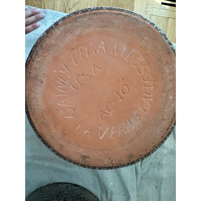 Vintage ceramic cylinder planter with a textured brown and tan glaze. This terracotta pot is made by Gainey Ceramics. It...