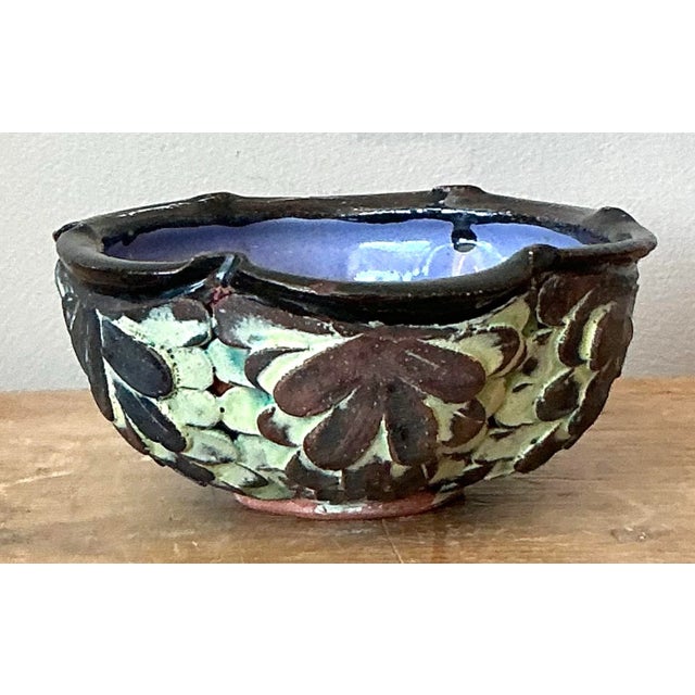 This remarkable studio pottery bowl is a miniature sculptural masterpiece, defined by its extraordinary applied texture...