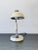 Handsome little table lamp attributed to early mid-century Italian design. Made out of painted ivory aluminum and natural...