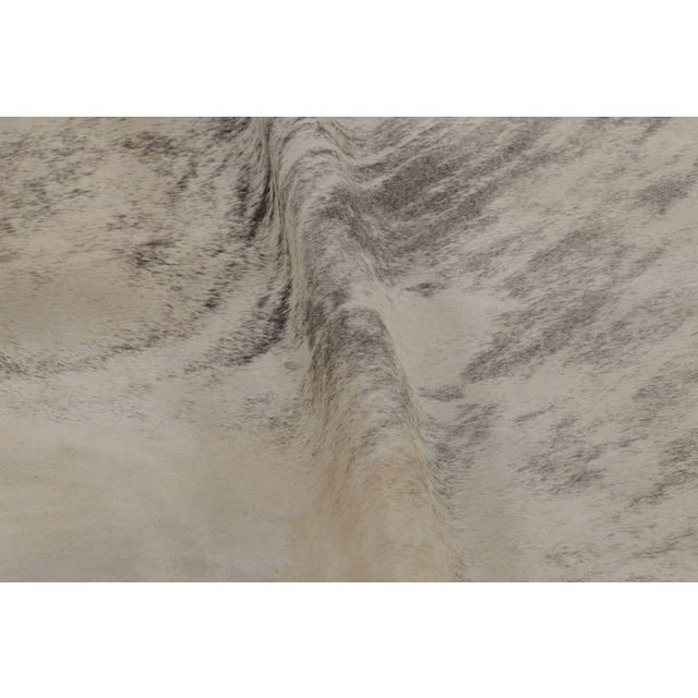 This handmade 7x8 contemporary cowhide rug from Rug & Kilim represents an exciting new collection of rare large-size...