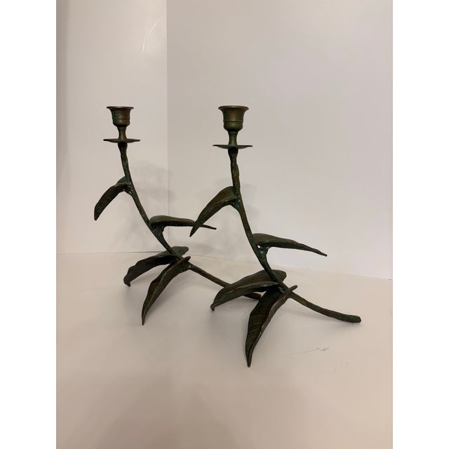 These candelabras command attention with their ornate leafy design. They feature a series of stylized leaves, each...