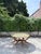 Vintage Mid Century Moroccan Embossed Brass Teak Wood Spider-Leg Coffee Table For Sale - Image 13 of 14