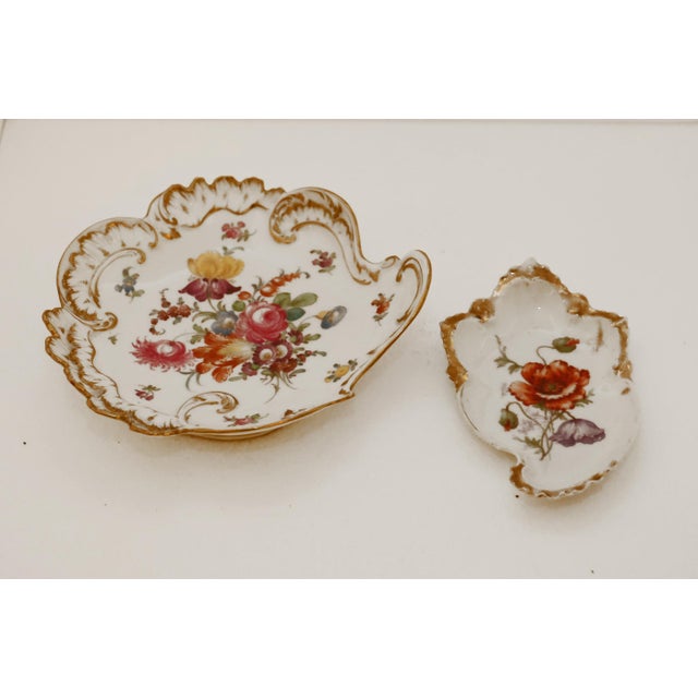 Pair of Porcelain Decorative Plates Two porcelain decorative plates, produced around 1910. Porcelain painting by Ambrosius...
