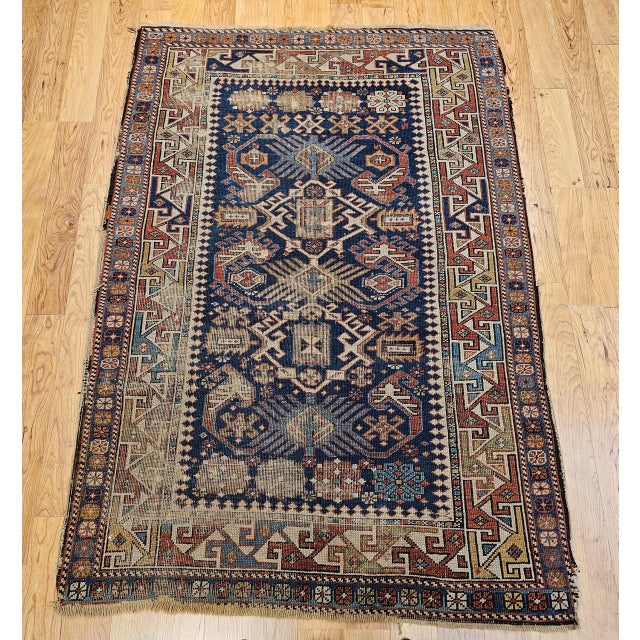 This exceptional late 19th century Caucasian Shirvan area rug exemplifies the artistry and enduring beauty of village...