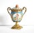 An antique, 19th-century French porcelain urn or lidded vase, with a "bleu celeste" background and medallions of a cherub...