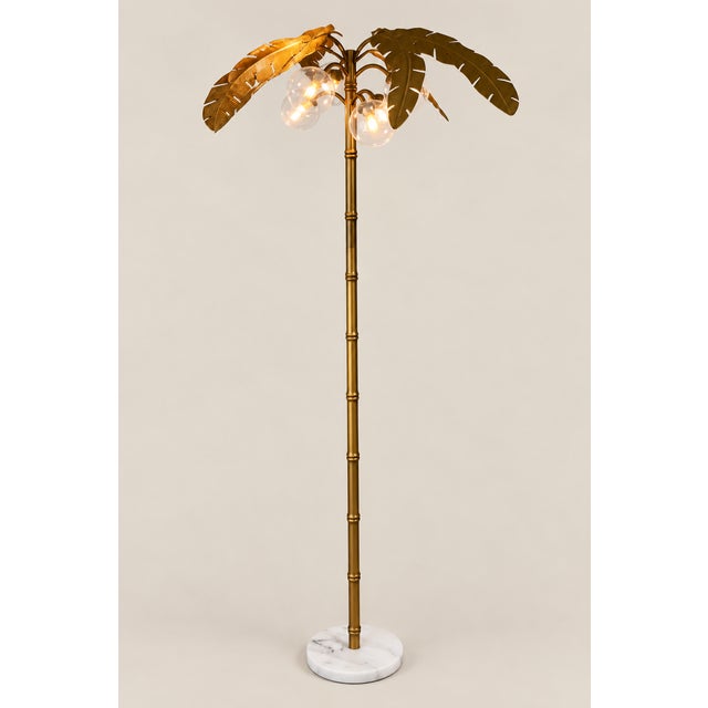 Offered is a Mid Century Palm tree floor lamp with six globe lights. The Palm fronds are removable for cleaning or...