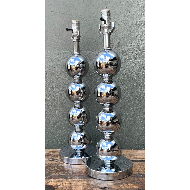 This pair of vintage stacked sphere table lamps channels the sleek modernist vocabulary associated with Kovacs-style...