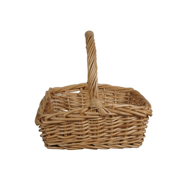 Late 20th century woven reed harvest / gathering basket. Square form with fixed twisted handle. Dimensions: 14" x 13.5" x...