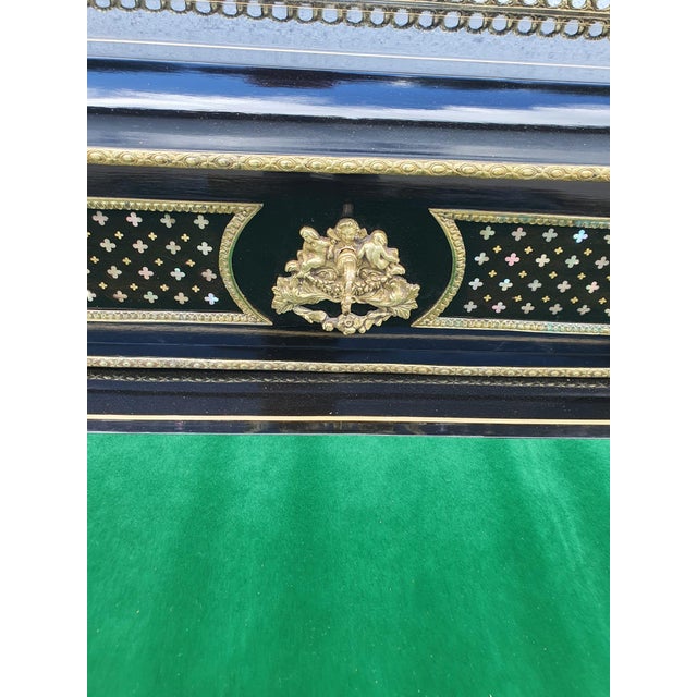 An elegant, delicately crafted lady's writing desk from the mid-19th century, meticulously restored, ebonized piece of...
