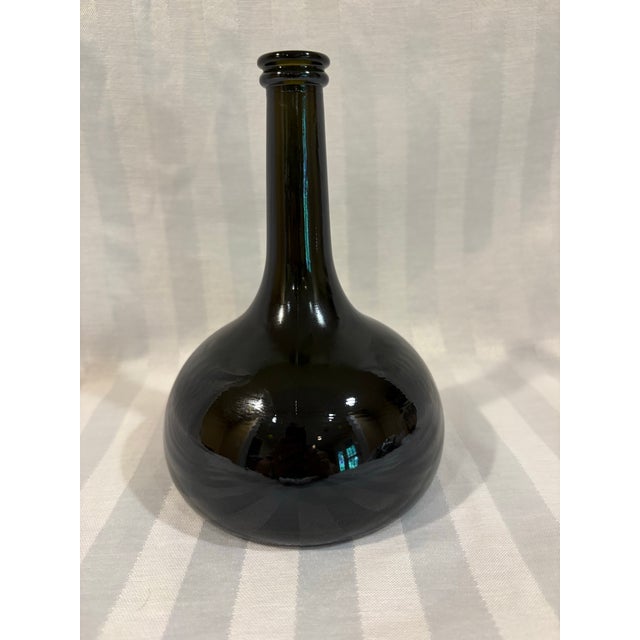 This modern era onion bottle would make a great decorative statement in a nautical or rustic European themed space. It has...