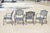 Contemporary Tuscan Mediterranean Style Black Cast Aluminum Metal Garden Patio Dining Chairs - Set of 4. Circa 21st...